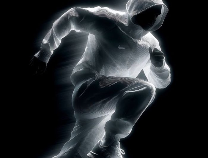 A sprinting figure rendered in radiographic white