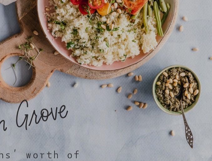 A composed grain-bowl lunch table from above