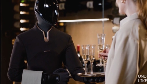 Black-suited Figure humanoid carrying a tray of drinks at a party