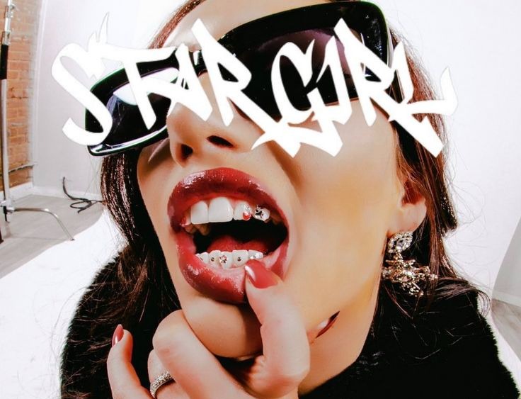 STARGIRL sprayed in white graffiti over a photograph