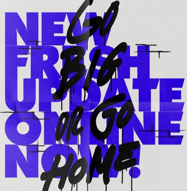 Go Big or Go Home sprayed in black over blue block type
