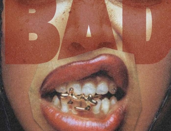 BAD printed over a photograph of a mouth with a gold grill