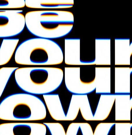Be Your Own in glowing white blurred type on black
