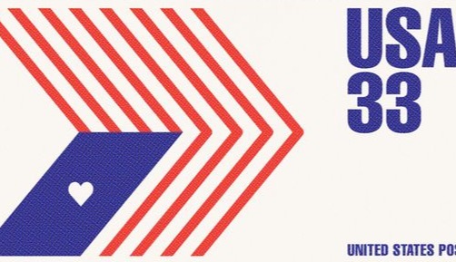 A USA 33 postage stamp with geometric chevrons and a heart