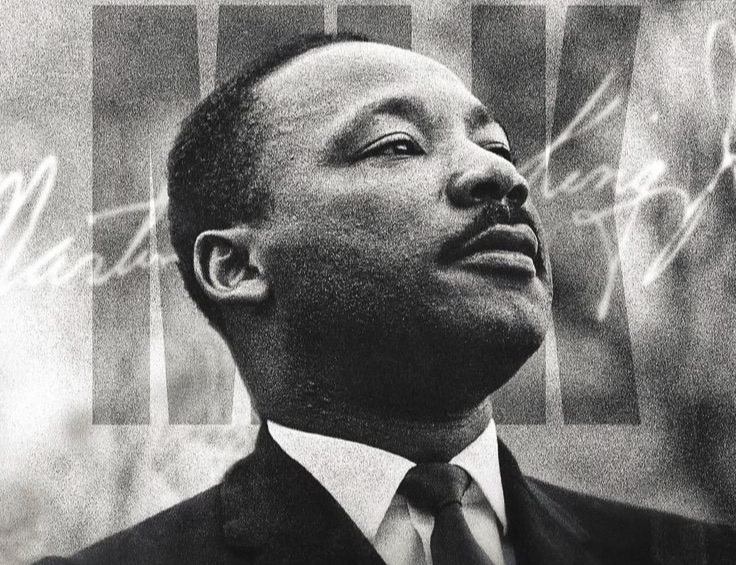 Black and white portrait of Martin Luther King Jr. with a flag overlay and his signature