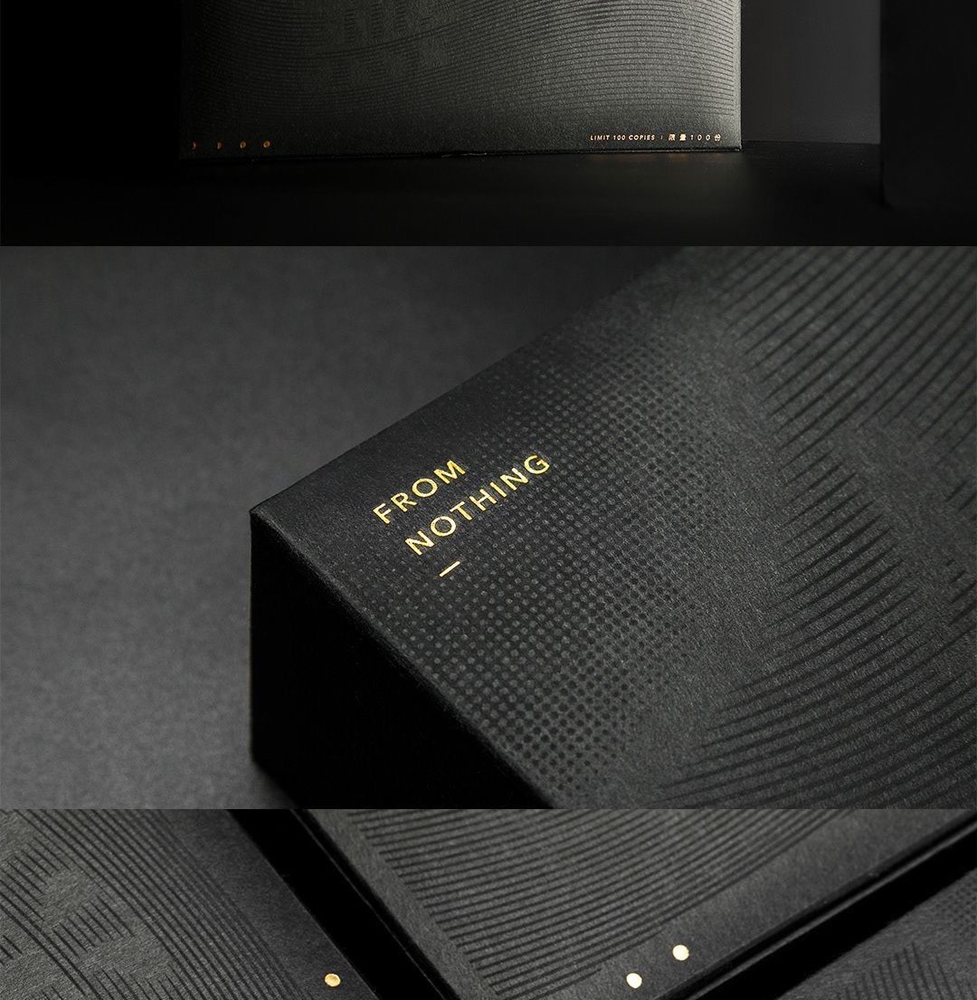 FROM NOTHING sans-serif gold foil on a debossed black box
