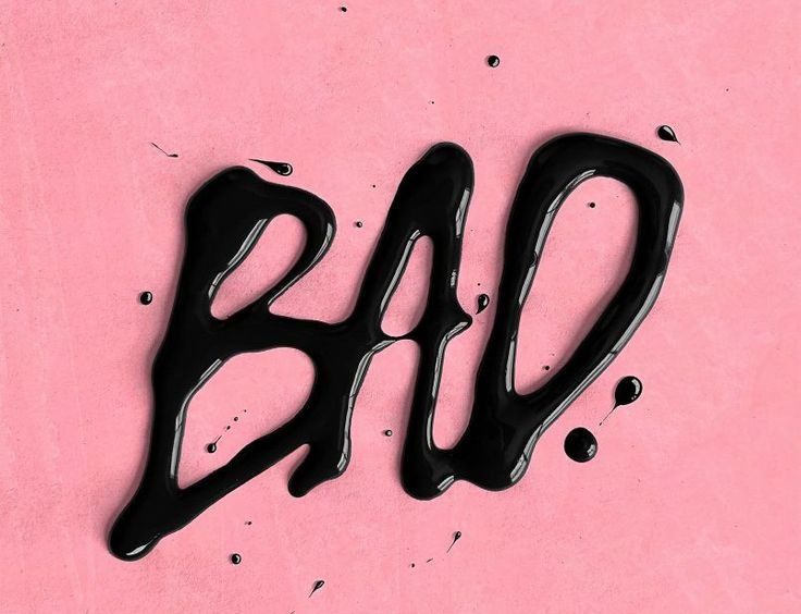 The word BAD in glossy dripping black on a pink ground